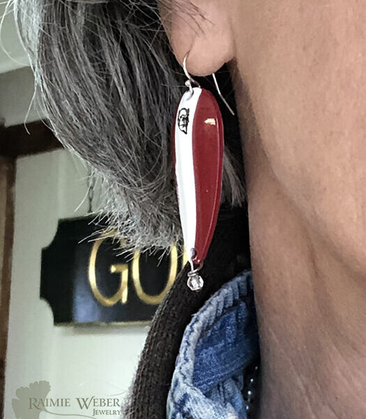 Dardevil earring hanging from ear