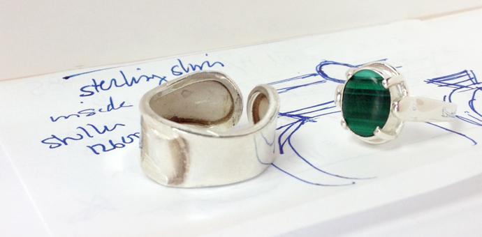 new malachite ring next to the old one, on top of the design sketch