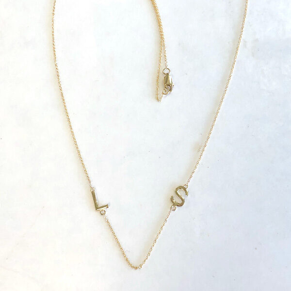 gold necklace with L and S initials on chain
