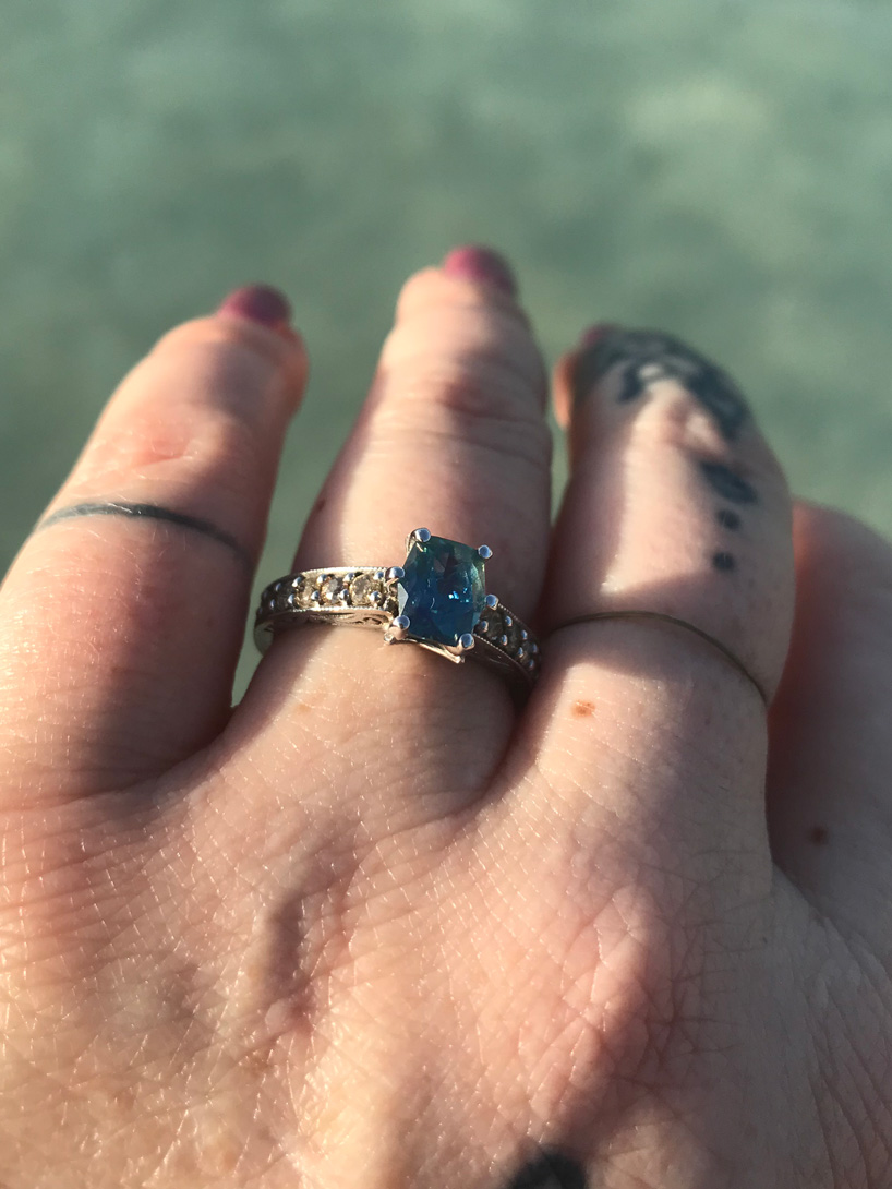 She's wearing her teal sapphire engagement ring