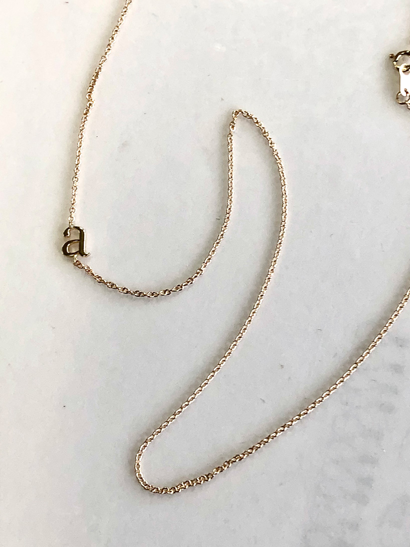 Gold lowercase "a" signet necklace