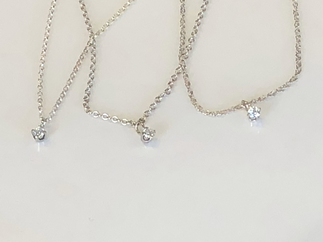 three sparkly diamond pendants for the daughters